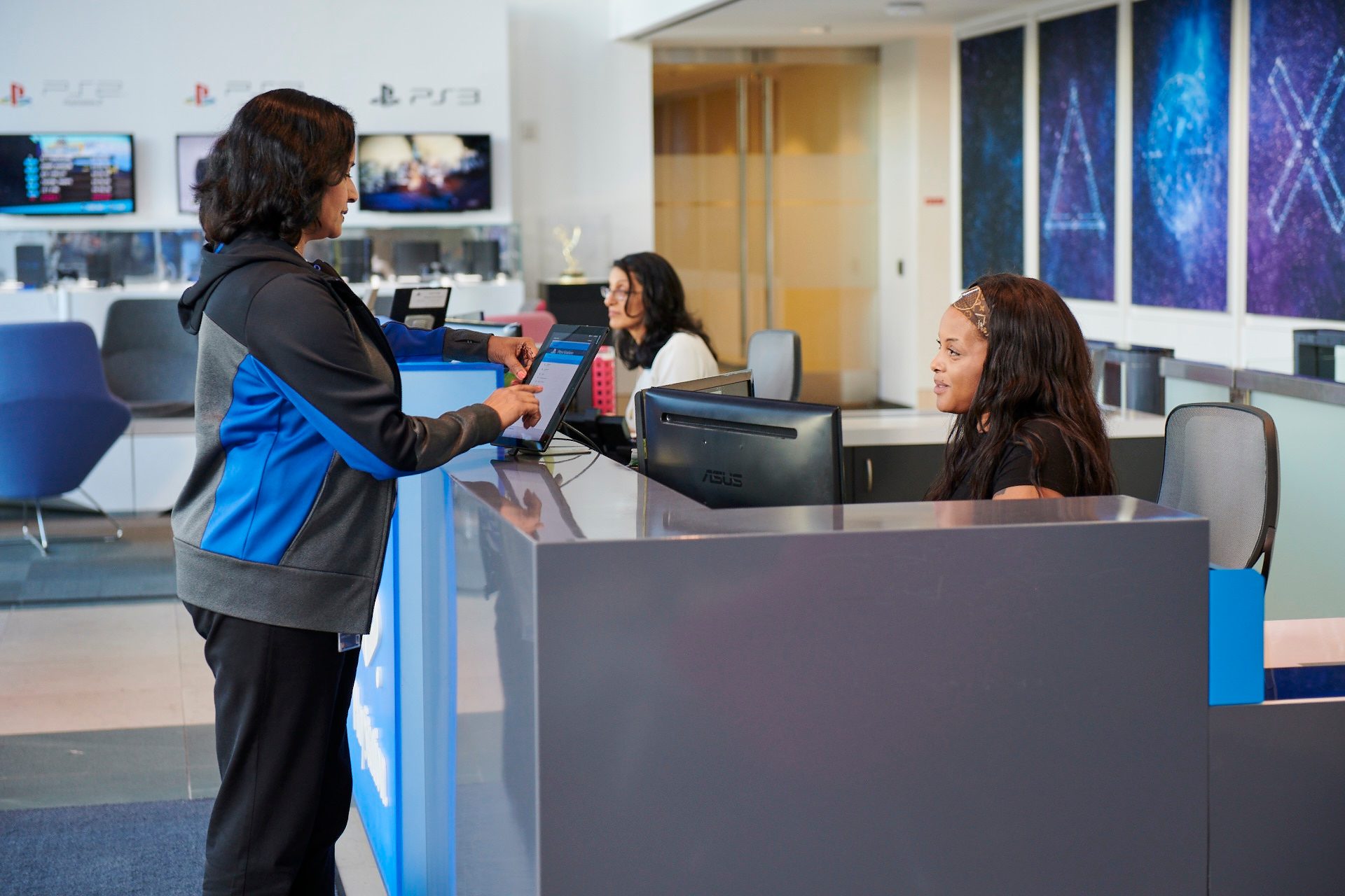 Media inquiries section of the site,  with an image of the front desk staff checking in a presumed media rep using an iPad check-in process.