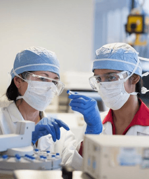 Two scientists in masks shown to promote Sony's work in supporting Covid-19 research.