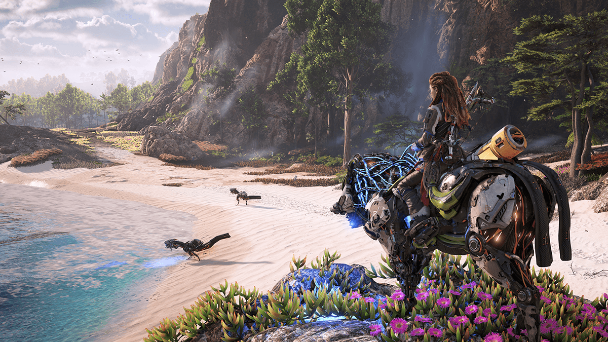 A character on a biomechanical mount looks out over a bright tropical shoreline as small robotic creatures roam near the waves.