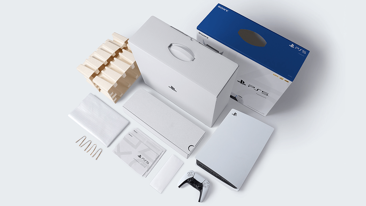 Unboxed PlayStation 5 components displayed, including the console, packaging materials, instructions, and accessories.