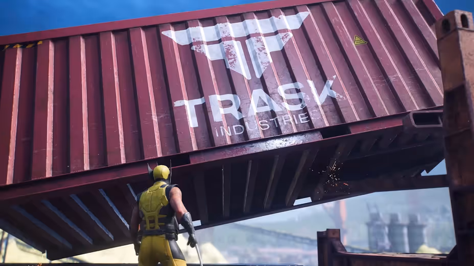 Wolverine in his yellow-and-black suit, viewed from behind, looking up at a massive red shipping container featuring the Trask Industries logo.