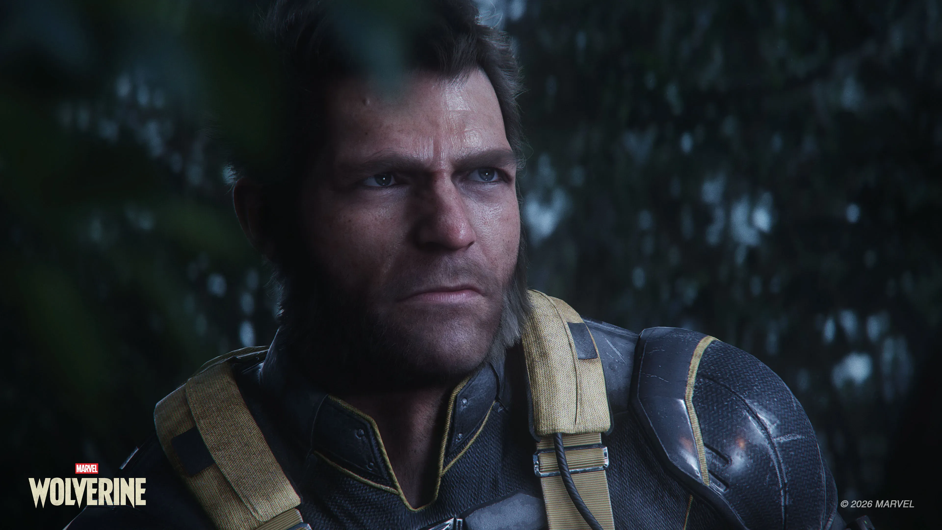 Close-up shot of Logan with a stern expression and mutton chops beard, wearing dark tactical suit gear with yellow shoulder straps in a dim forest environment. The Marvel's Wolverine logo is in the bottom left corner.