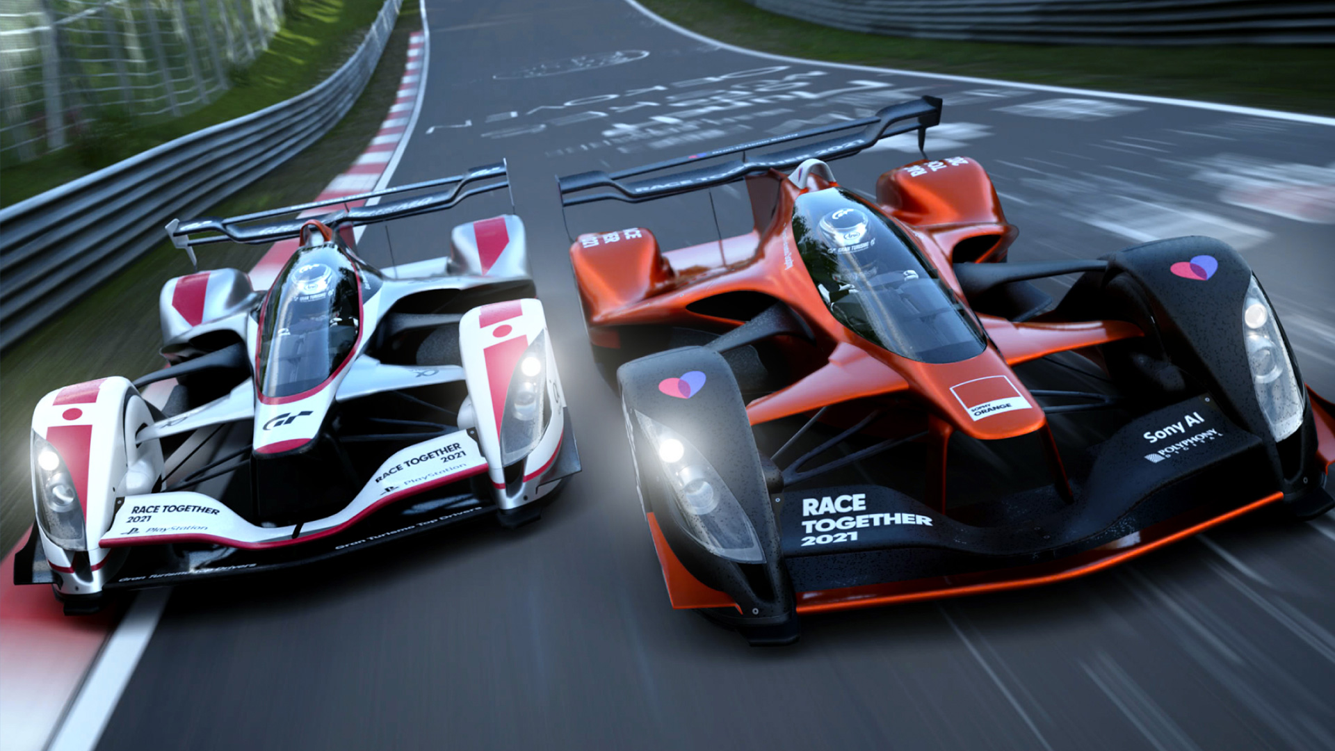 Two formula race cars race side by side. The car on the left is white. The car on the right is orange.